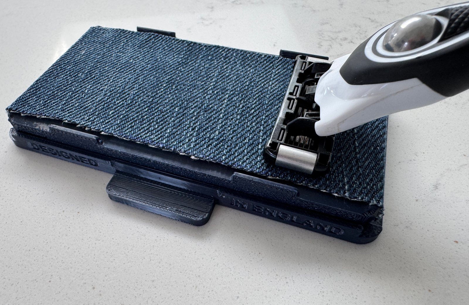 Razor being drawn across the Razor Maintainer denim strip, thumbnail